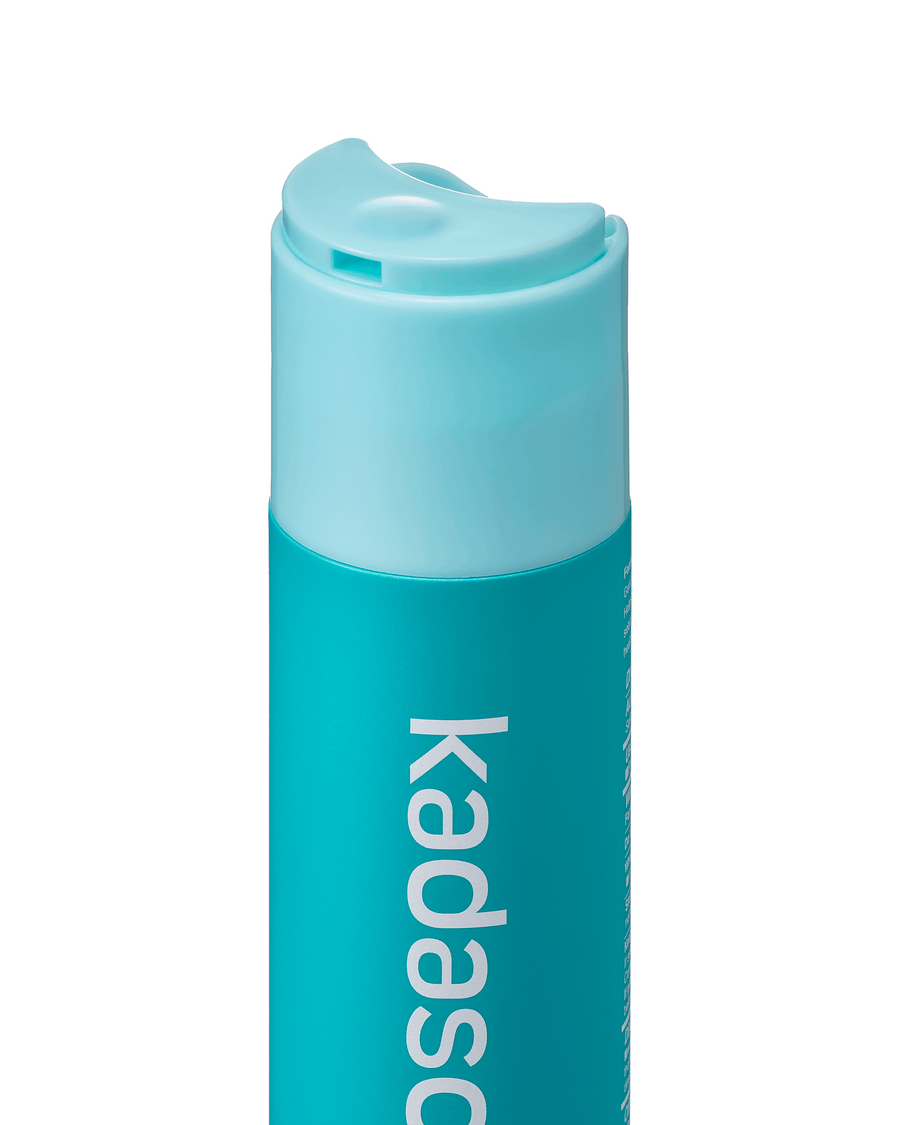 Kadason shampoo bottle with flip-top cap open